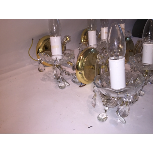 47 - Four Brass And  glass wall lights