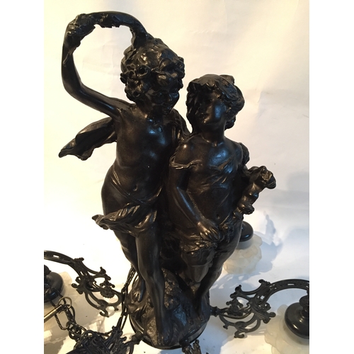 65 - A Cherub Six Branch Chandelier Of Spelter Construction With Two Embracing Cherub Centrepiece.