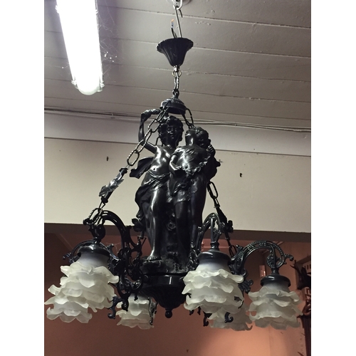 65 - A Cherub Six Branch Chandelier Of Spelter Construction With Two Embracing Cherub Centrepiece.