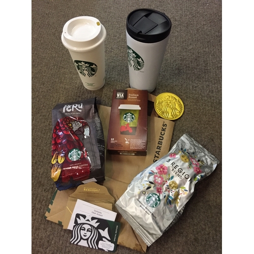 106 - £10 Starbucks Gift Voucher  along with a selection of coffee , cups , beans and chocolate.