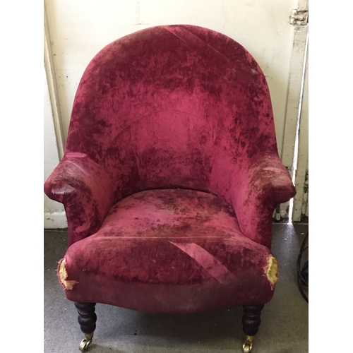 40 - Wing Back Chair on turned front feet with brass casters , Upholstery needs attention.