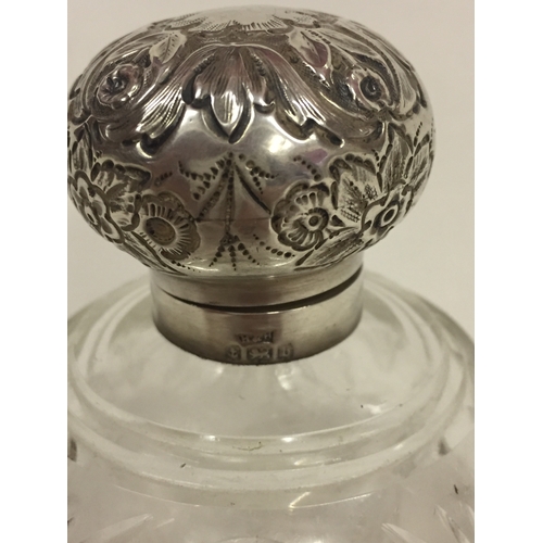 103a - Solid Silver Hallmarked Medallion Along With A Silver Toped Antique Scent Bottle.