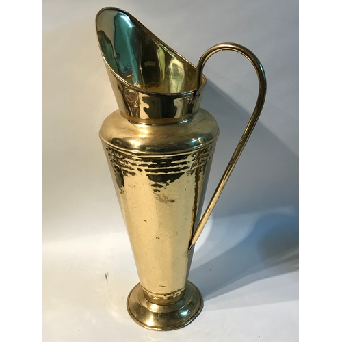 67 - Similar To Previous Lot Large Brass Umbrella Stand In The Form Of A Water Jug Measures 54cm High