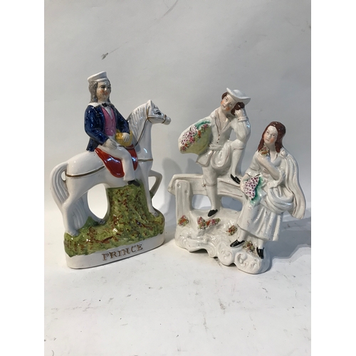 242 - 2 x Porcelain Ornaments To Include Prince On A Horse and One Other