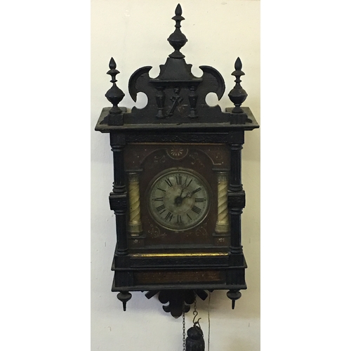 152 - Vintage Weight Driven Wall Clock Wood Cased With Finials.