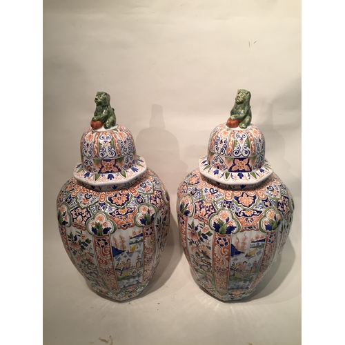 138 - Pair Of Delft lided vases 55cm