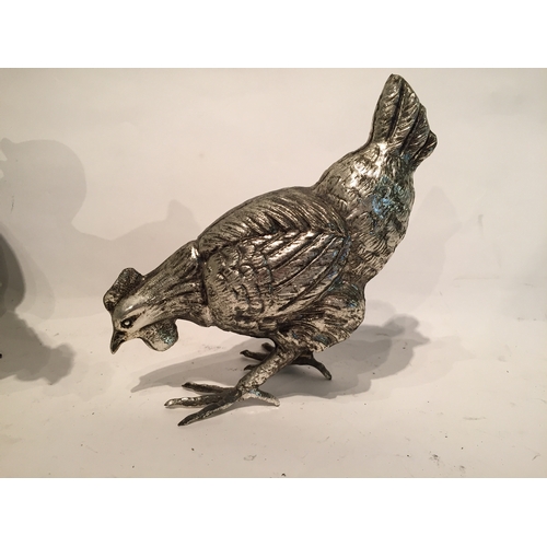 277 - Pair silver coloured Metal chickens 18cm