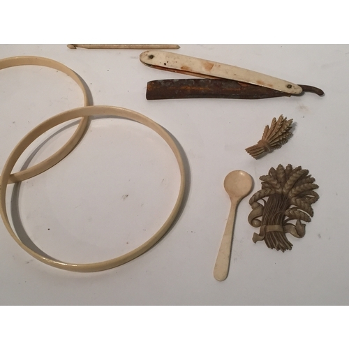 128 - Antique ivory items to include fans , bands , button hooks etc