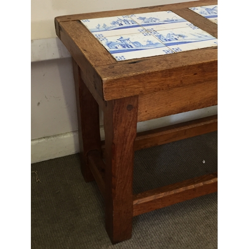 17 - Rustic heavily Constructed  Tile  topped table with delft Tile inserts 101cm x 38cm x 55cm