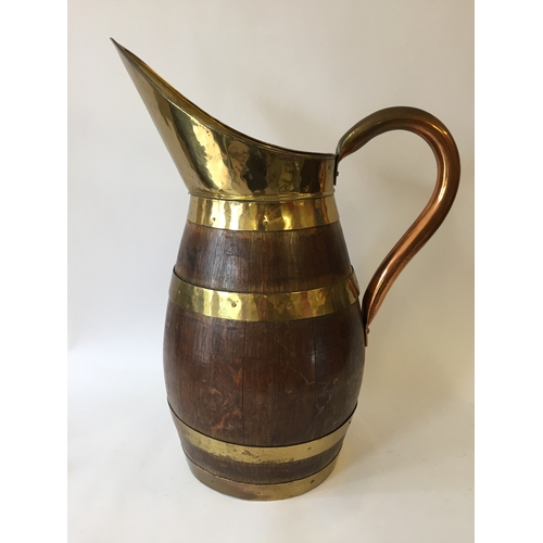 115 - Wooden brass bound stick or umbrella stand in the form of a jug 57cm tall