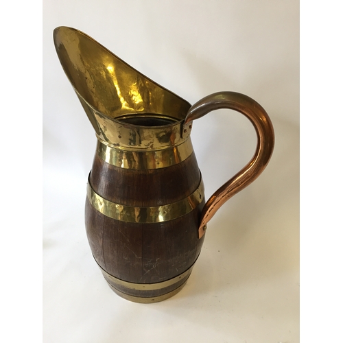 115 - Wooden brass bound stick or umbrella stand in the form of a jug 57cm tall