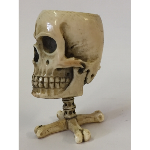 112 - Antique Prisoner of war ivory vesta case in the form of a skull on bone cross standing 6.5cm high