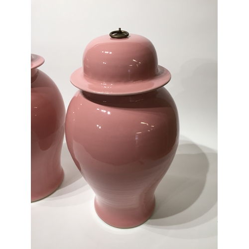 130 - Pair of pink chinese lidded vases 54cm tall