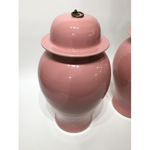 130 - Pair of pink chinese lidded vases 54cm tall