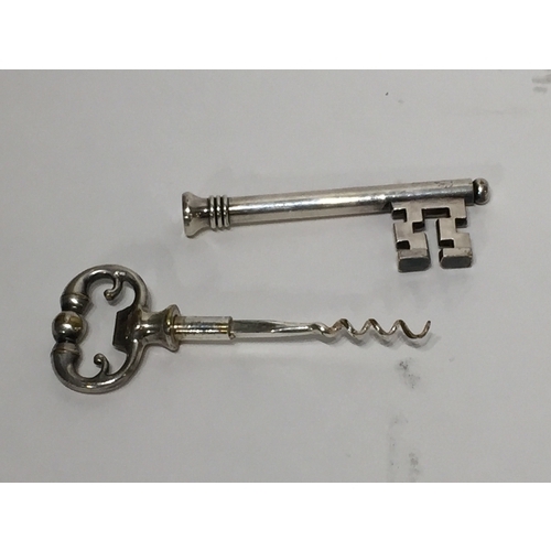 107 - Silver coloured Novelty cork screw in the form of a key 20.5cm long