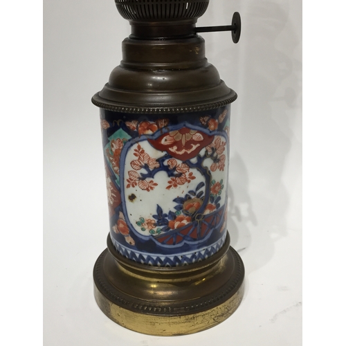 136 - Vintage Oil lamp with ceramic base 50cm tall