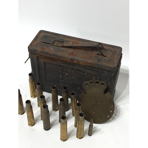 262 - US army ammo box along with spent rounds and brass military plaque