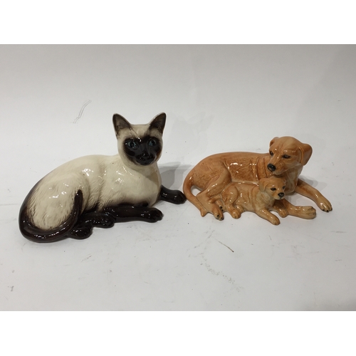 332 - Two royal doulton figures of cat and dog