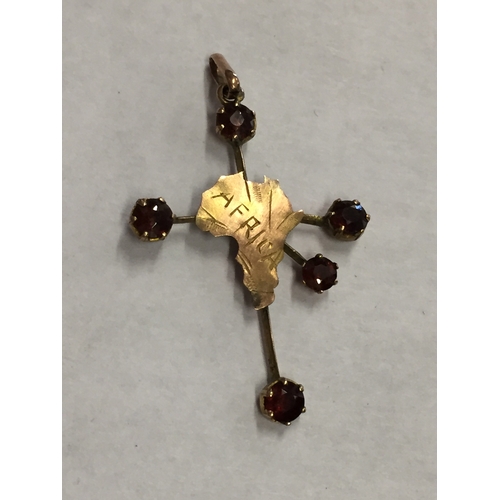 322 - 9ct gold pendant of Africa with Ruby Or Garnet  stones