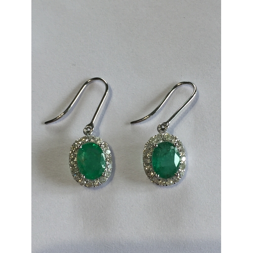 281 - 1 Pair Of 14 ct White Gold Diamond And Emerald Sheppard Hook Earrings , With Two  Oval Cut Natural E... 