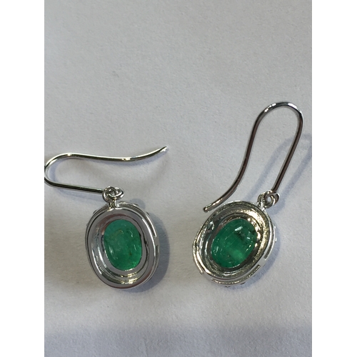 281 - 1 Pair Of 14 ct White Gold Diamond And Emerald Sheppard Hook Earrings , With Two  Oval Cut Natural E... 