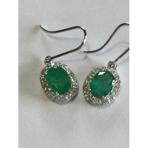 281 - 1 Pair Of 14 ct White Gold Diamond And Emerald Sheppard Hook Earrings , With Two  Oval Cut Natural E... 