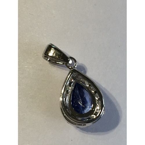 294 - 14 Ct White Gold Sapphire And Diamond Pendant.Featuring One Pear Cut Natural Sapphire  Along With 16... 