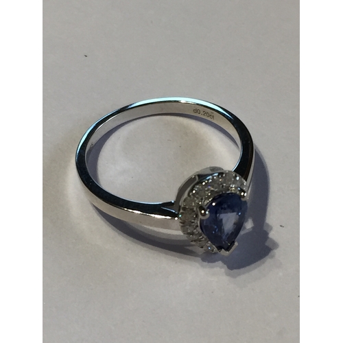 296 - 14 Ct White Gold Sapphire And Diamond Ring.Featuring One Pear Cut Natural Sapphire  Along With 16 Ro... 