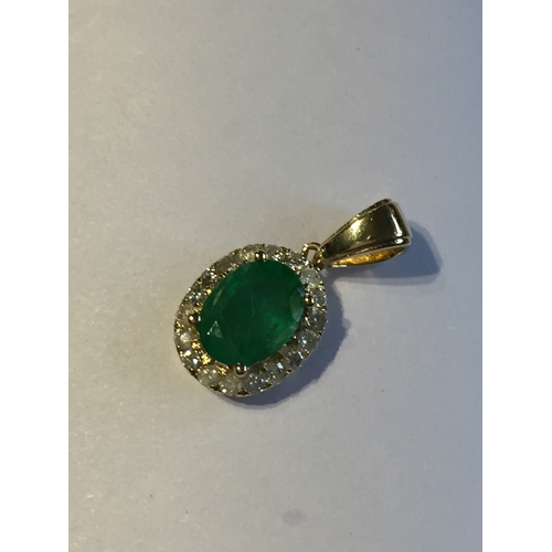 298 - 14 Ct Yellow Gold Emerald And Diamond Pendant .Featuring One Oval Cut Natural Emerald Along With 18 ... 