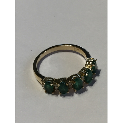 300 - 14 Ct Yellow Gold Emerald And Diamond Ring.Featuring Five Oval  Cut Natural Emeralds Along With 12 R... 