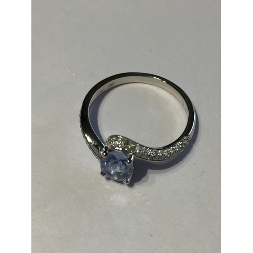 302 - 14 Ct White Gold Sapphire And Diamond Ring .Featuring One Oval Cut Natural Sapphire  Along With 64 R... 