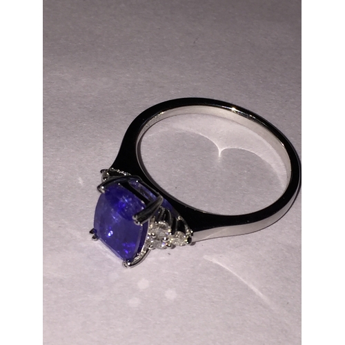 303 - 18 Ct White Gold Tanzanite And Diamond Ring .Featuring One Rectangle Cushion Cut  Natural size N1/2T... 