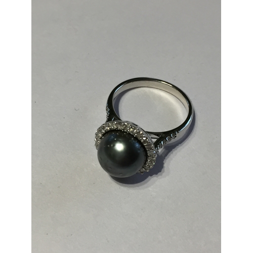 306 - 14 Ct White Gold Tahitian Pearl And Diamond Ring Featuring One Round Tahitian Pearl Surrounded BY 25... 