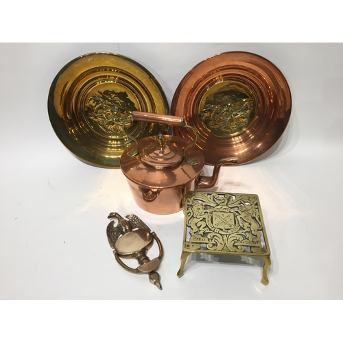 207 - A copper kettle brass trivet ,door knocker, two spun plates