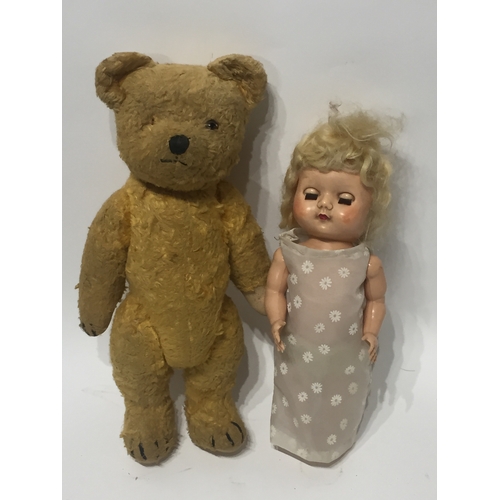 211 - A vintage teddy bear with articulated limbs along with a vintage doll (2)