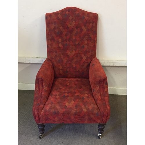 62 - Upholstered armchair with caster feet