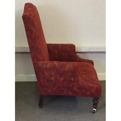 62 - Upholstered armchair with caster feet