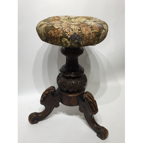 2 - A carved Wood stool with upholstered swivel seat