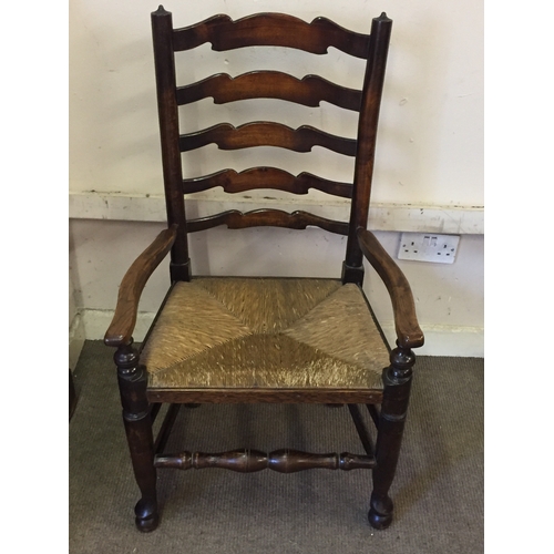 14 - A ladder back rush seated chair