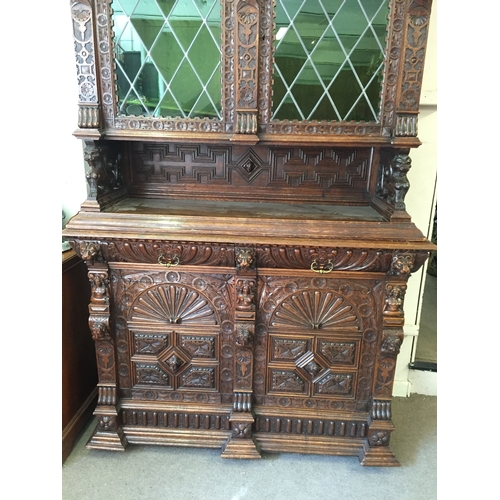 50 - Profusely Carved French Two Piece Hunt Cabinet 256 cms High X 153 X 57