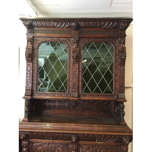 50 - Profusely Carved French Two Piece Hunt Cabinet 256 cms High X 153 X 57