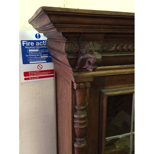 57 - European Glazed Bookcase With Carved Lion Head Decoration 163 x 99 x 41 cms