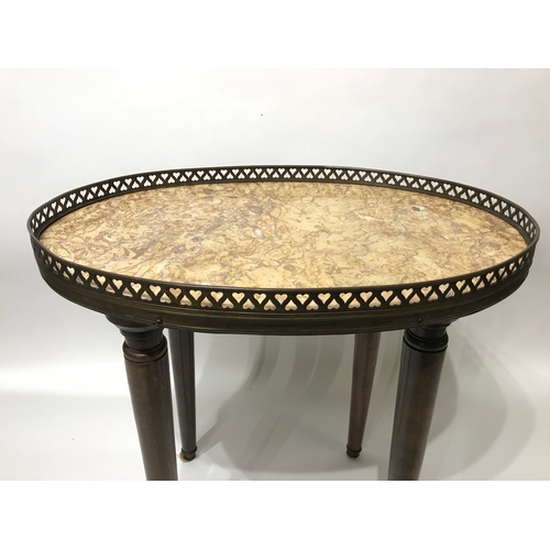 8 - Marble Tob Oval Table Of Small Proportions With Brass Gallery . 46 x 30 x 45 cms