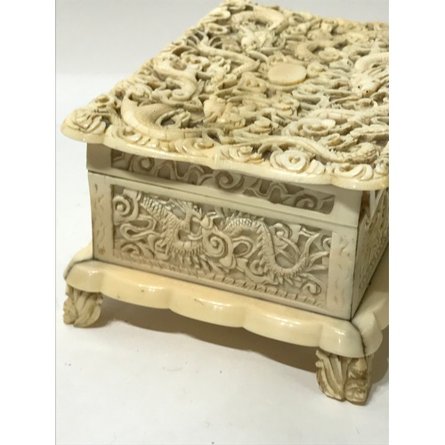 368 - Heavily Carved Antique Ivory Trinket Box. 15 x 10 x 7.5 cms