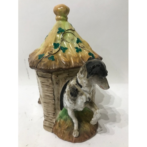 423 - Novelty Ceramic Lidded Tobacco Jar In The Form Of A dog And Kennel .19 cms High