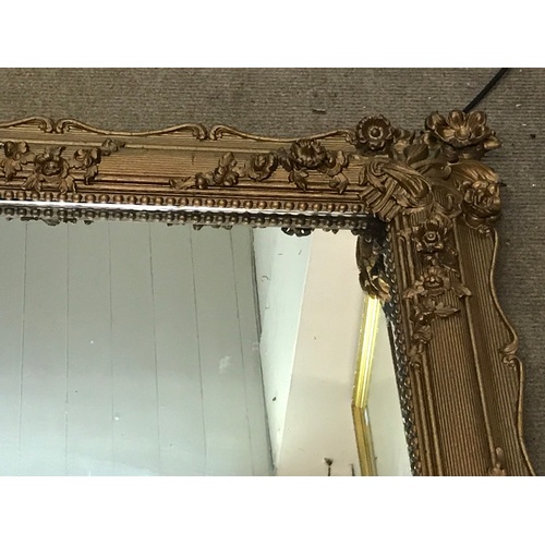 53 - Large Antique Panelled Back Mirror With Gilt Flower Decoration. 174 x 105 cms