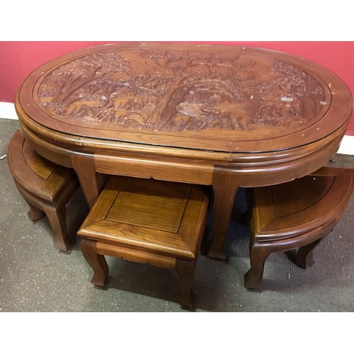 6 - Asian Profusely Carved Top Wood Table With 6 Pull Out Stools 125 x 85 x 52 cms