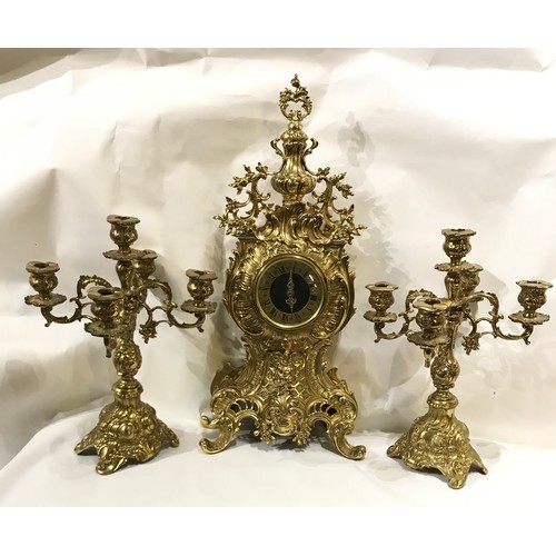 223 - Large French Brass Clock Set With Candlestick Garnitures. 60 cms High