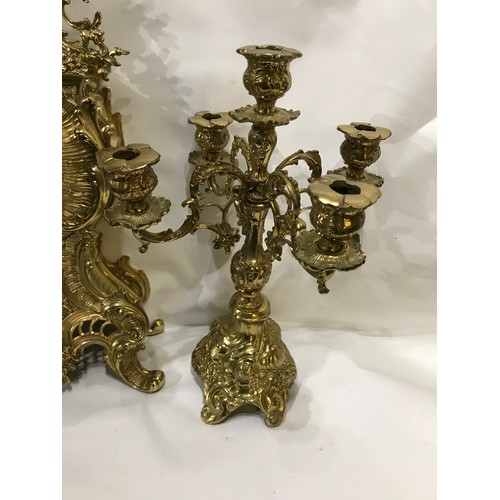 223 - Large French Brass Clock Set With Candlestick Garnitures. 60 cms High