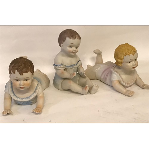 108 - Three Ceramic Figures In The Form Of Baby's.  23cms Long For The One Lying Down. (3)